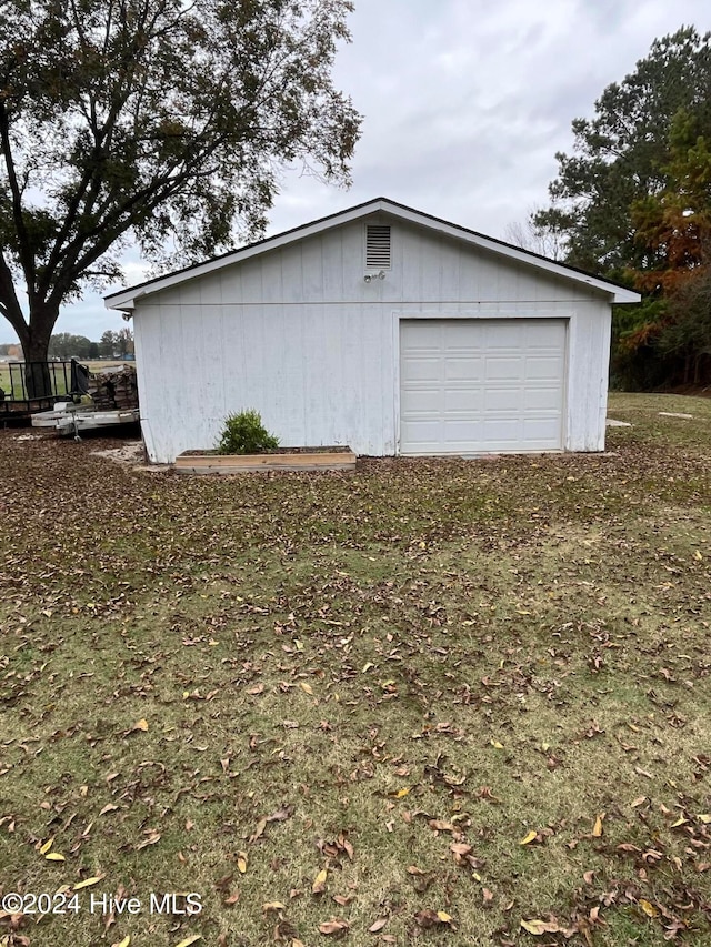 view of home's exterior with an outbuilding and a garage