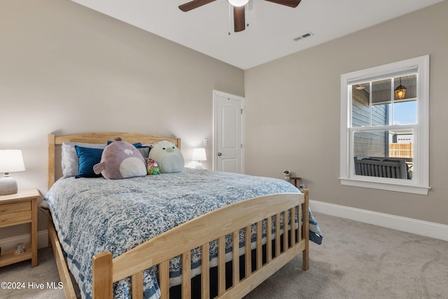 bedroom featuring ceiling fan and carpet