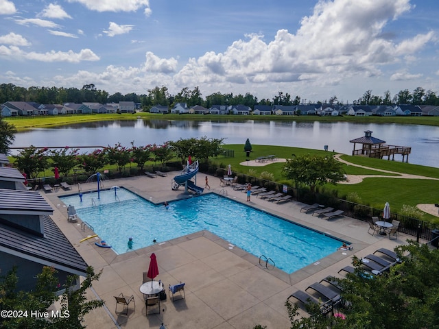 view of pool featuring a patio area, a gazebo, and a water view