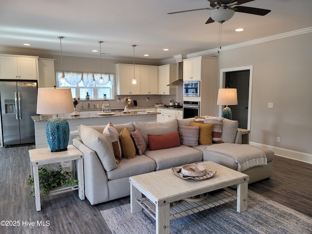 living room with ceiling fan, dark wood-type flooring, and ornamental molding