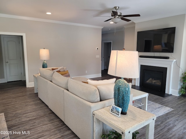 living room with ceiling fan, ornamental molding, and dark hardwood / wood-style flooring