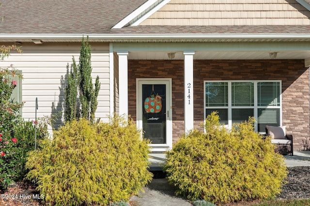 doorway to property featuring a porch