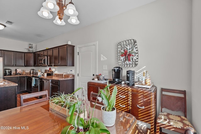 dining space featuring a notable chandelier