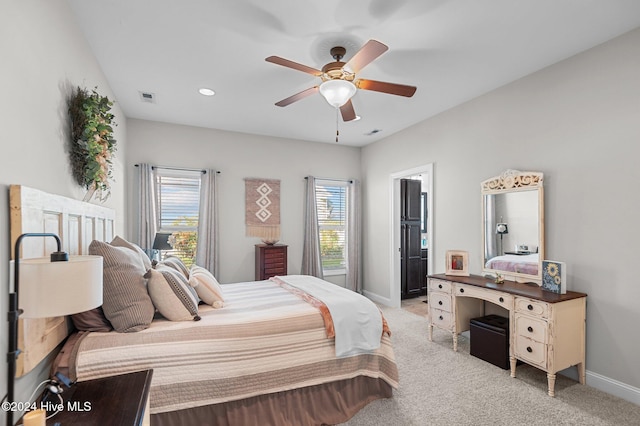 carpeted bedroom featuring ceiling fan