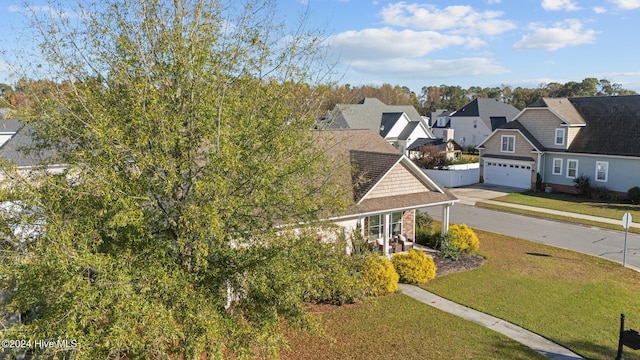 exterior space featuring a front lawn and a porch