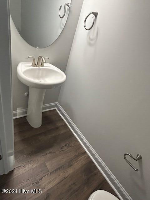 bathroom with wood-type flooring