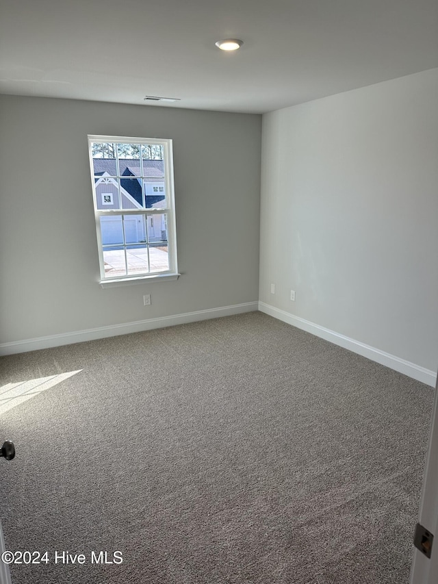 empty room featuring carpet flooring