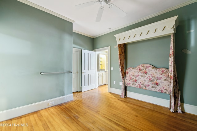 unfurnished bedroom featuring hardwood / wood-style floors, ceiling fan, and crown molding