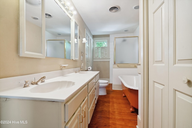 full bathroom featuring vanity, hardwood / wood-style flooring, toilet, and independent shower and bath