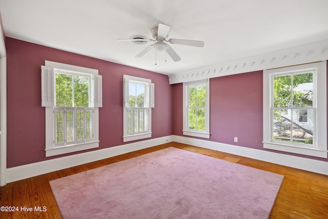 unfurnished room featuring ceiling fan and dark hardwood / wood-style flooring