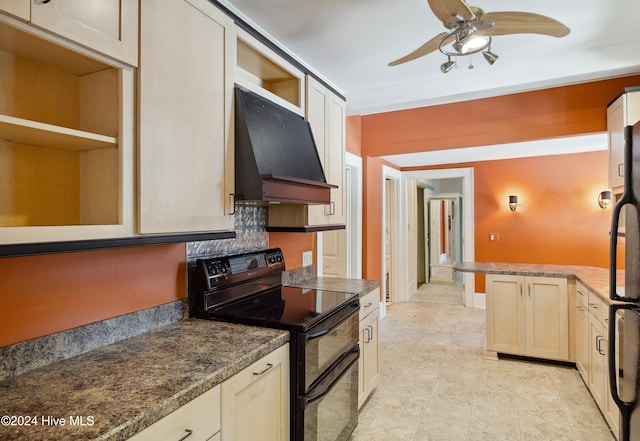 kitchen with dark stone countertops, black range with electric stovetop, ceiling fan, fridge, and premium range hood