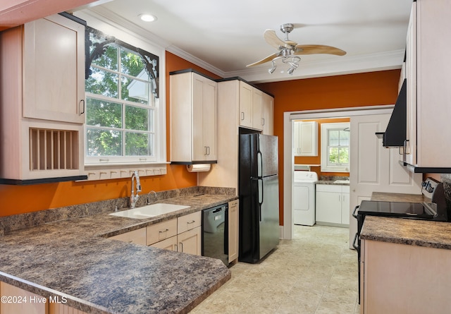 kitchen with a healthy amount of sunlight, sink, black appliances, and washer / clothes dryer