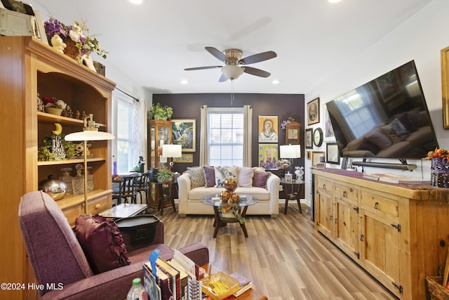 living room featuring recessed lighting, a ceiling fan, light wood-style floors, and a healthy amount of sunlight