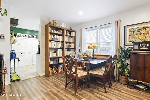 dining space featuring recessed lighting and light wood-type flooring