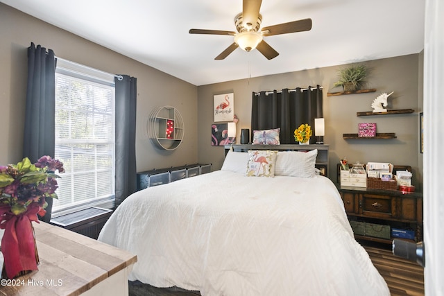 bedroom featuring a ceiling fan and wood finished floors