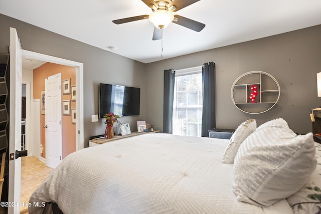 bedroom with tile patterned floors and a ceiling fan