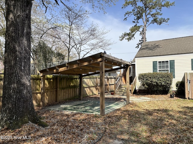 view of yard featuring stairs and fence