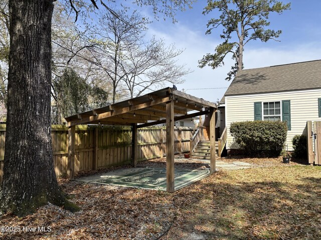 rear view of house featuring an outbuilding, a lawn, a storage shed, and a fenced backyard