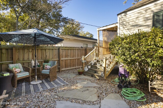 exterior space with an outbuilding and a fenced backyard