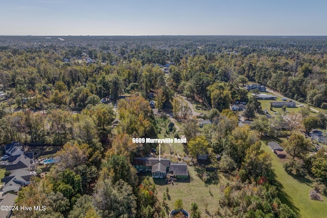 6609 Murrayville Rd, Wilmington, NC 28411 - aerial view of property and surrounding area featuring a heavily wooded area
