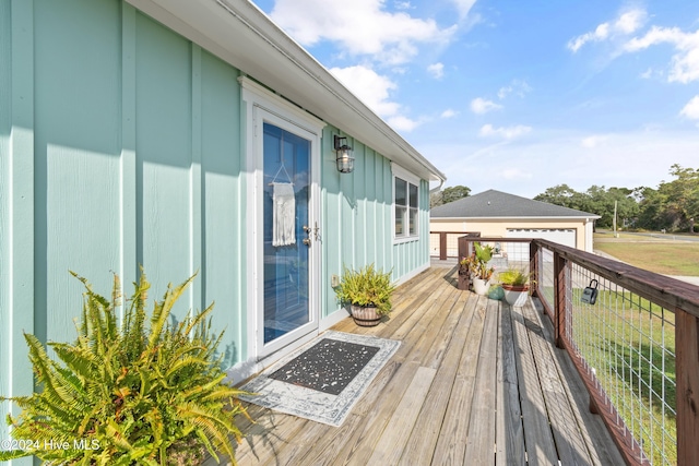 wooden deck with a garage