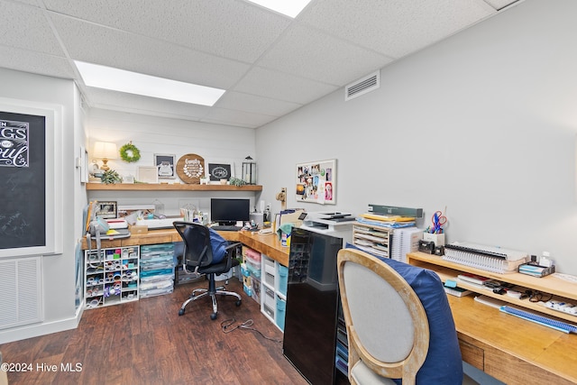 office area with dark wood-type flooring and a drop ceiling