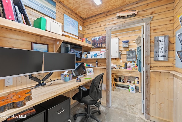 home office with concrete flooring