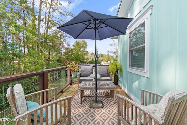 wooden deck featuring an outdoor living space