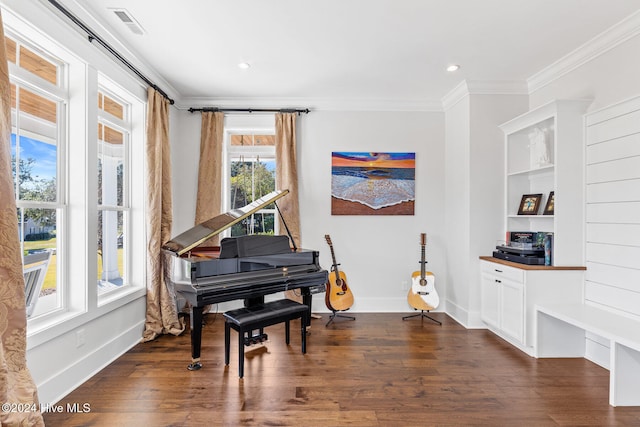 misc room with dark hardwood / wood-style flooring and ornamental molding