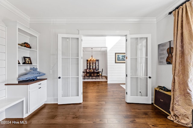 interior space with french doors, dark hardwood / wood-style floors, and a notable chandelier