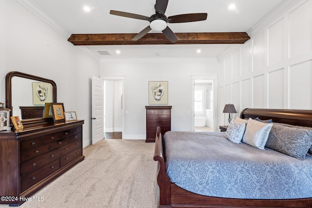 carpeted bedroom with beam ceiling, ceiling fan, ensuite bathroom, and ornamental molding