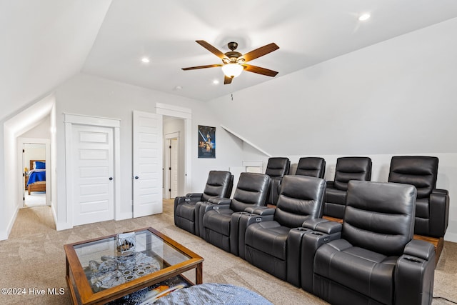 carpeted cinema featuring ceiling fan and lofted ceiling