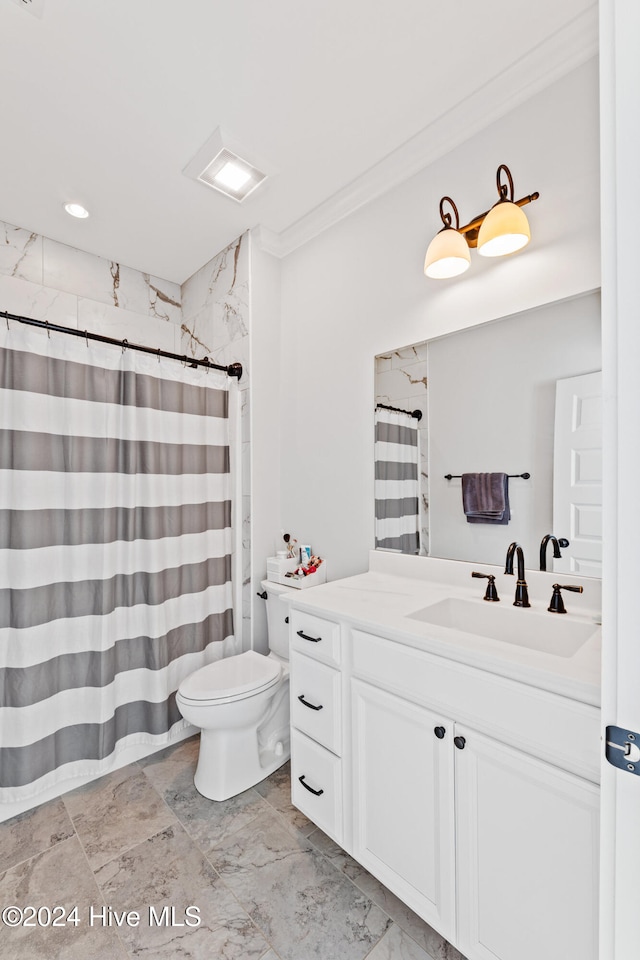 bathroom with vanity, toilet, ornamental molding, and walk in shower