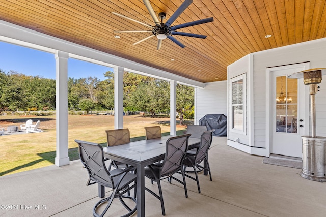 view of patio with ceiling fan and area for grilling