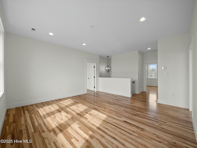 unfurnished room featuring light hardwood / wood-style floors