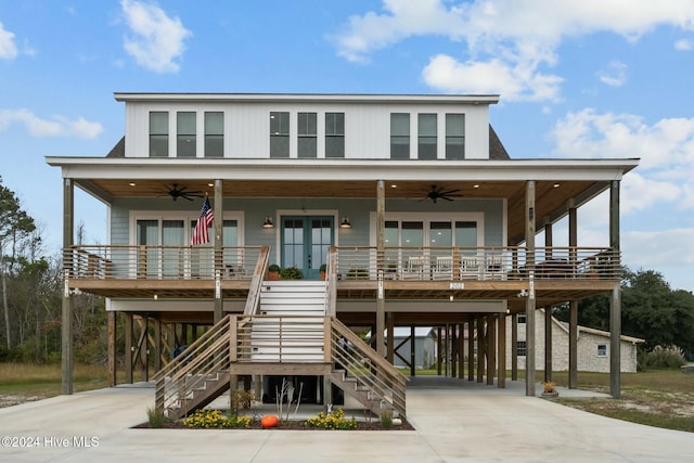 view of front of house featuring covered porch, french doors, a carport, and ceiling fan