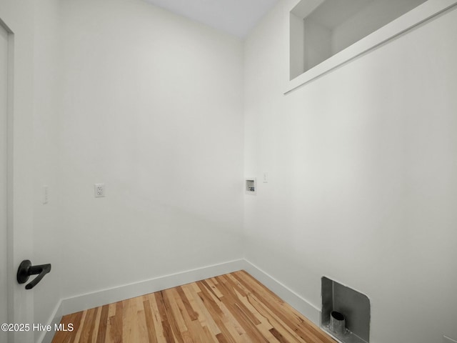 washroom featuring washer hookup and hardwood / wood-style flooring