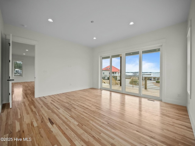 unfurnished room featuring light hardwood / wood-style flooring