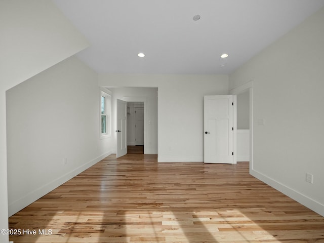 unfurnished bedroom with light wood-type flooring