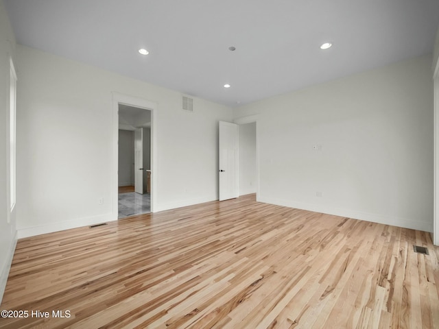 unfurnished room with light hardwood / wood-style flooring