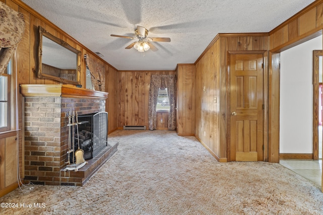 unfurnished living room featuring ceiling fan, a fireplace, and a textured ceiling