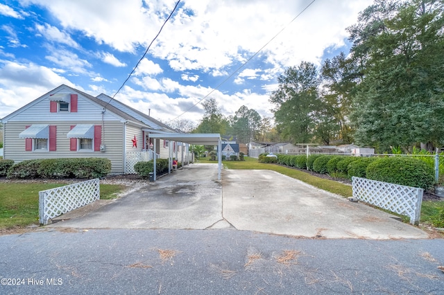 view of property exterior featuring a carport