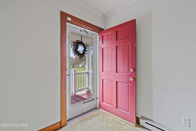 entryway featuring baseboard heating, crown molding, and carpet