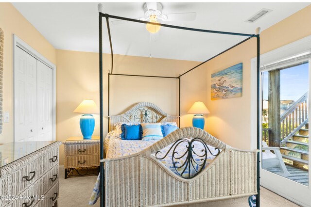 bedroom featuring ceiling fan, carpet floors, a closet, and visible vents