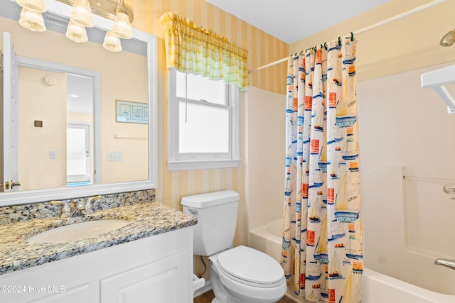 full bath featuring toilet, wallpapered walls, shower / bath combination with curtain, and vanity