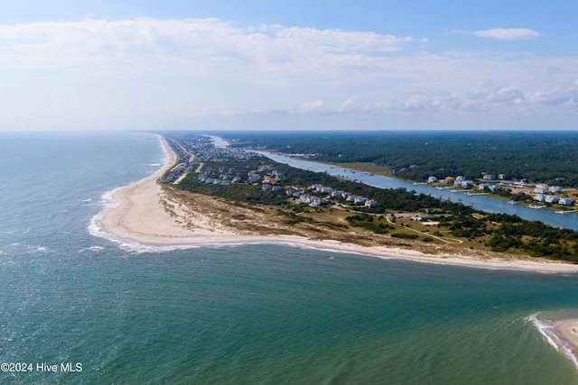 birds eye view of property with a view of the beach and a water view