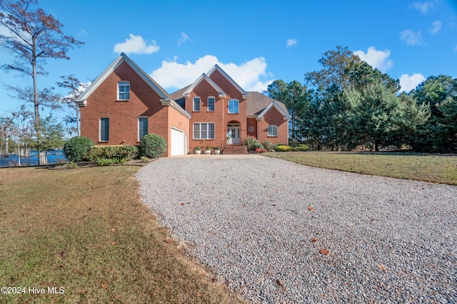 front of property with a garage and a front yard