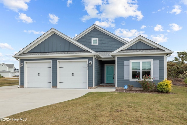 view of front of home featuring a garage and a front lawn