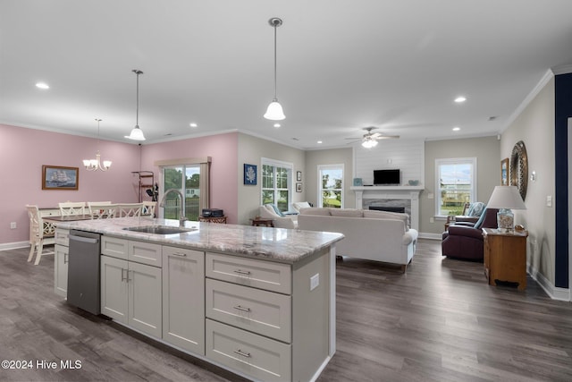 kitchen with pendant lighting, a healthy amount of sunlight, and sink