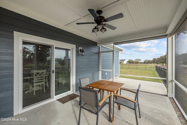 sunroom / solarium with ceiling fan